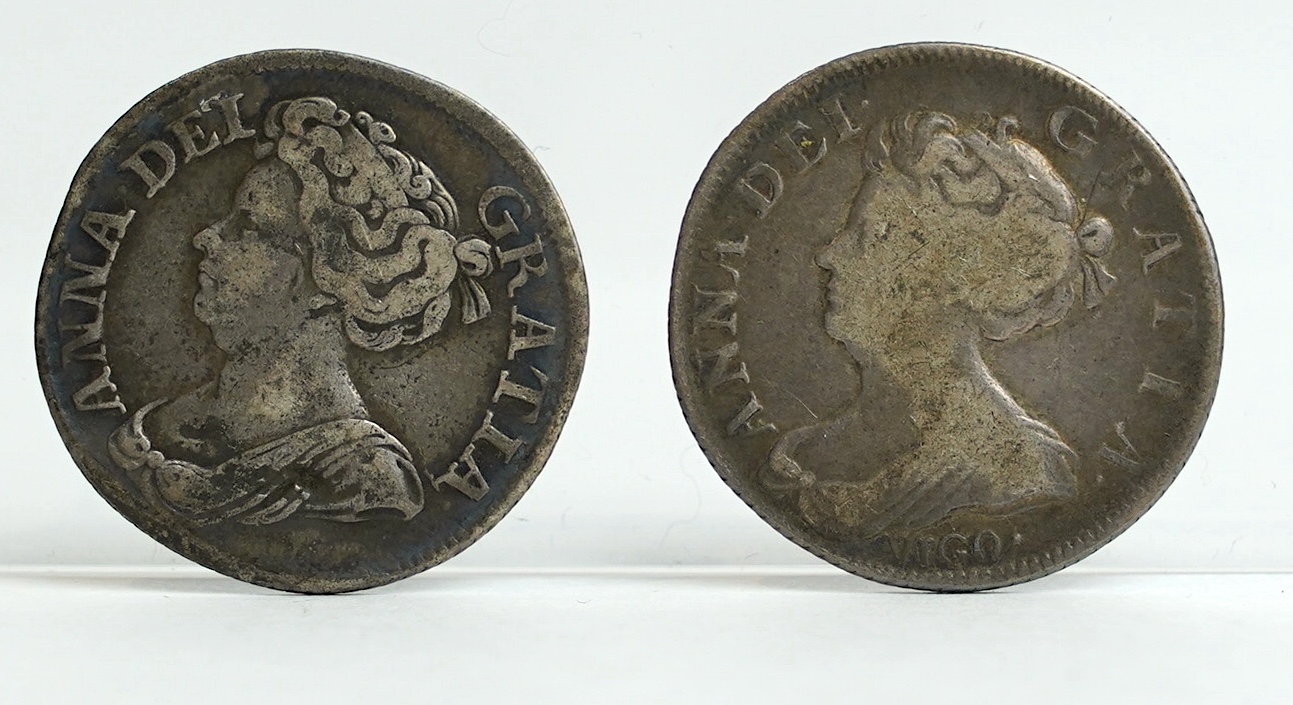 British silver coins, Anne (1702-1714), shilling, 1711 (S3618), good fine and shilling 1703 VIGO (S3586), VG or better (2)